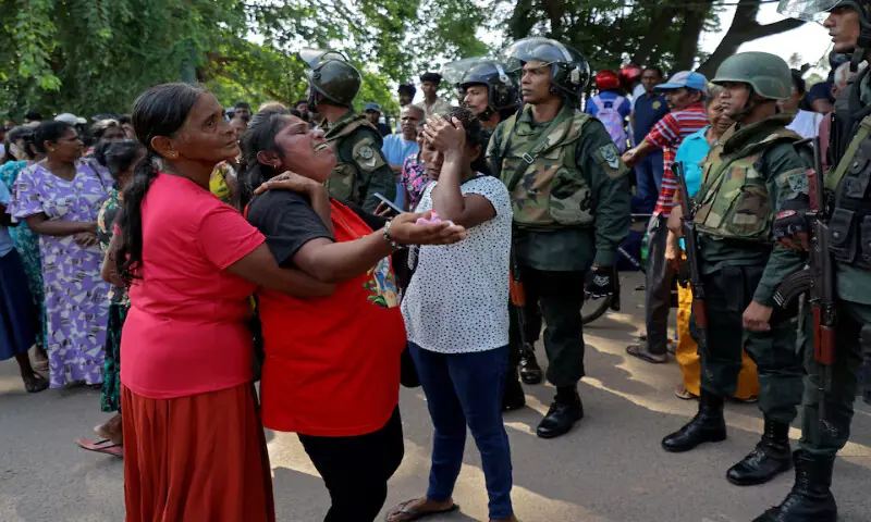 Relatives of inmates react outside Negombo Prison following clashes between two groups of inmates in the coastal town of Negombo, Sri Lanka, on Monday. -- Reuters