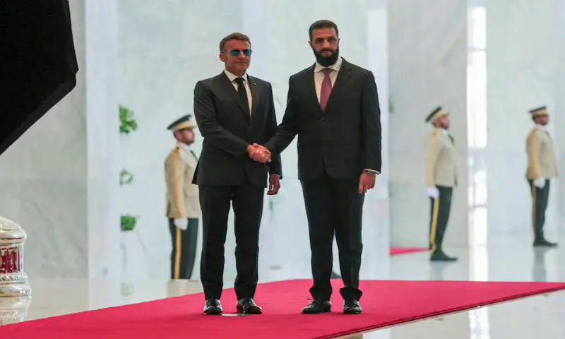 France's President Emmanuel Macron meets Syrian President Ahmed Al Sharaa at the People's Palace in Damascus, Syria, on Tuesday. -- Reuters