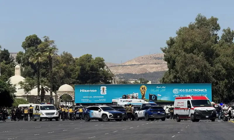 Emergency vehicles and personnel at the site where explosive devices blew up near a hotel where French President Emmanuel Macron was meant to be staying, in Damascus, Syria, July 7, 2026. REUTERS/Yamam Al Shaar Purchase Licensing Rights, opens new tab