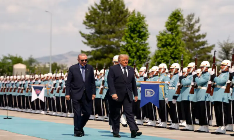US President Donald Trump walks with Turkish President Recep Tayyip Erdogan during a formal arrival at the Bestepe Presidential Compound at the NATO summit in Ankara, Turkey. -- Reuters