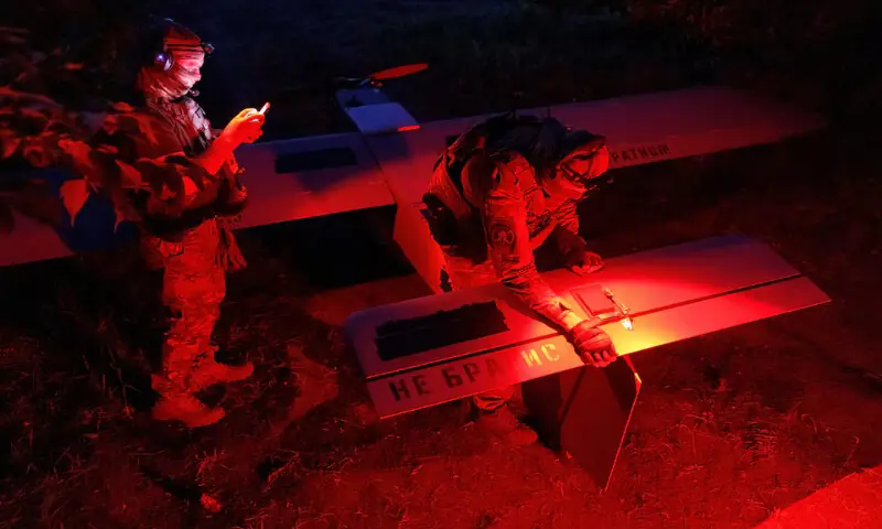 Service members of the Ukrainian Armed Forces prepare a Zozulia mid-strike drone at an undisclosed location in southern Ukraine. -- Reuters