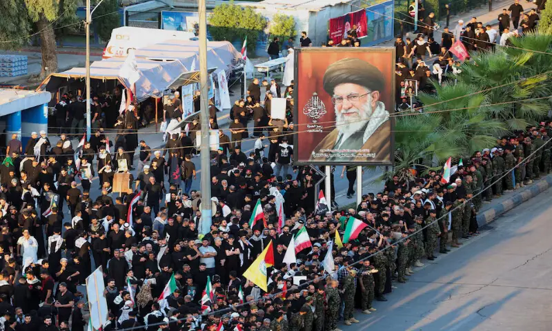 People gather on the day of a funeral procession for Iran's late Supreme Leader Ayatollah Ali Khamenei in Najaf, Iraq, on Wednesday. -- Reuters