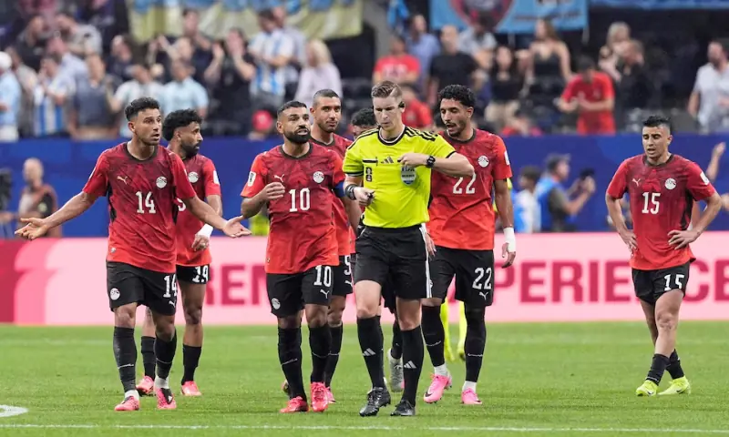 Egypt's Mohamed Salah remonstrates with referee Francois Letexier after Argentina's Enzo Fernandez scores their third goal. -- Reuters