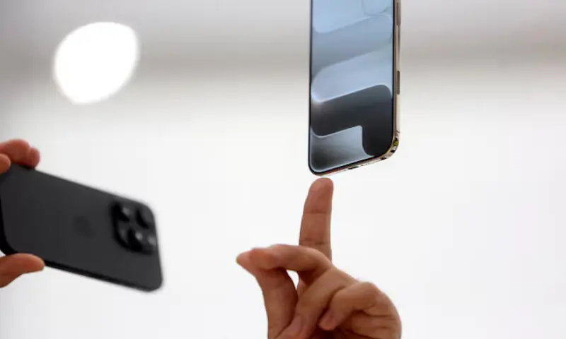 A person points to an iPhone during Apple's event at the Steve Jobs Theatre on its campus in Cupertino, California, US. -- Reuters file A person points to an iPhone during Apple's event at the Steve Jobs Theatre on its campus in Cupertino, California, US. -- Reuters file