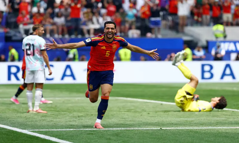 Spain's Mikel Merino celebrates scoring their second goal. -- Reuters