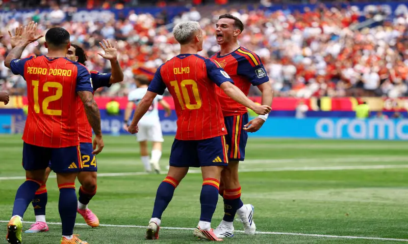 Spain's Fabian Ruiz celebrates scoring their first goal with Dani Olmo and Pedro Porro. -- Reuters