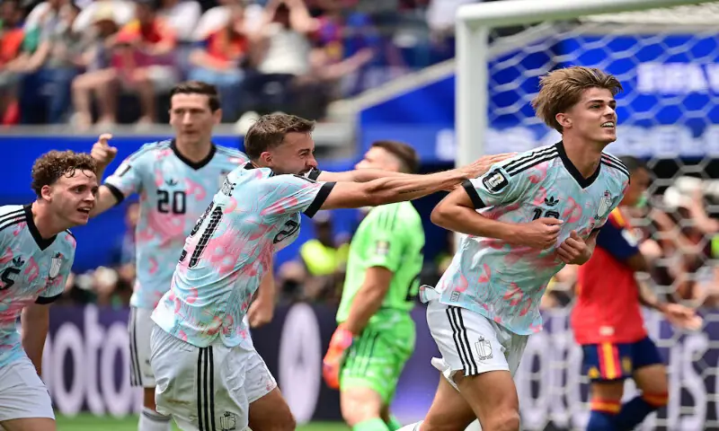 Belgium's Charles De Ketelaere celebrates scoring their first goal with Timothy Castagne. -- Reuters
