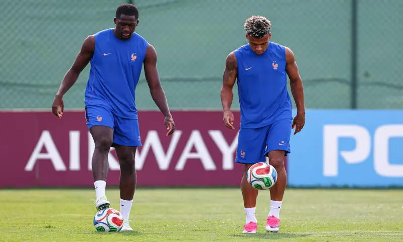 France defender Ibrahima Konate (15) and midfielder Desire Doue (20) during a training session at Melanie Lane Training Grounds. -- Reuters