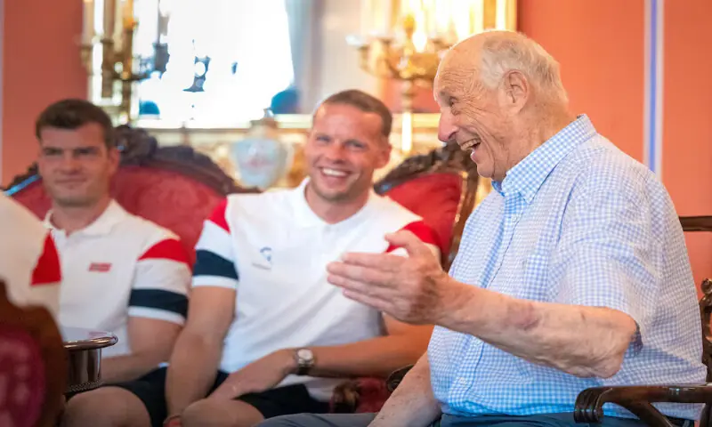 King Harald with Orjan Haskjold Nyland and other members of national football team in Oslo, Norway. -- Reuters King Harald with Orjan Haskjold Nyland and other members of national football team in Oslo, Norway. -- Reuters