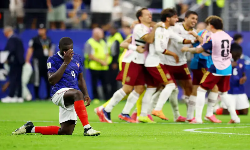France's Dayot Upamecano look dejected after the match as France are eliminated as Spain players celebrate after qualifying for the World Cup final at Dallas Stadium, Arlington, Texas. -- Reuters