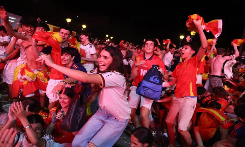 Spain fans celebrate at the fan zone in the Plaza de Colon in Madrid, Spain, after the match. -- Reuters