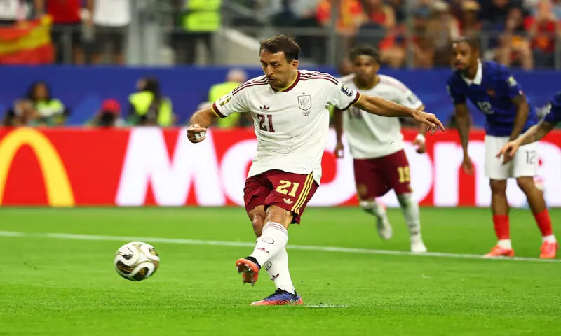 Spain's Mikel Oyarzabal scores their first goal from the penalty. -- Reuters