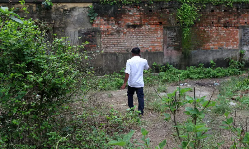 Father of an 11-year-old girl who was raped and killed speaks on his mobile phone in a town near Kolkata, West Bengal, India. -- Reuters Father of an 11-year-old girl who was raped and killed speaks on his mobile phone in a town near Kolkata, West Bengal, India. -- Reuters