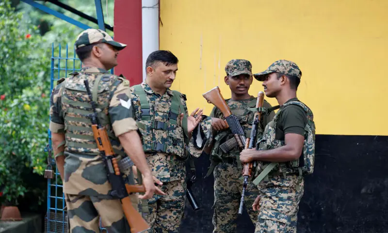 Border Security Force personnel guard a street following the rape and murder of an 11-year-old girl in a town near Kolkata, India. -- Reuters Border Security Force personnel guard a street following the rape and murder of an 11-year-old girl in a town near Kolkata, India. -- Reuters