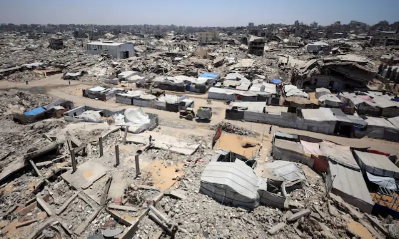 Displaced Palestinians shelter in tents near the rubble of buildings destroyed during the Israeli attacks in Gaza City. -- Reuters Displaced Palestinians shelter in tents near the rubble of buildings destroyed during the Israeli attacks in Gaza City. -- Reuters
