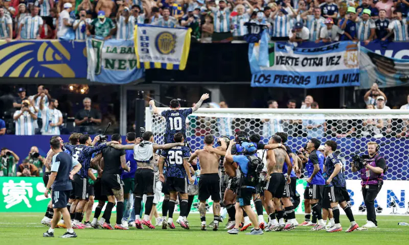 Argentina's Lionel Messi and teammates celebrate after the match. -- Reuters