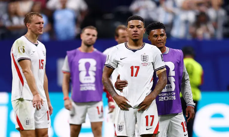 England's Morgan Rogers and teammates look dejected after the match as England are eliminated from the World Cup. -- Reuters