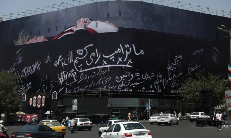 A billboard depicting US President Donald Trump laid in a coffin is displayed on a building in Tehran, Iran. -- Reuters