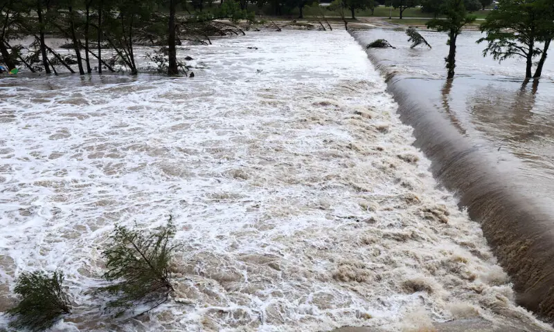 The Guadalupe River rises as heavy rains and severe weather hit southern Texas, in Kerrville, Texas. -- Reuters