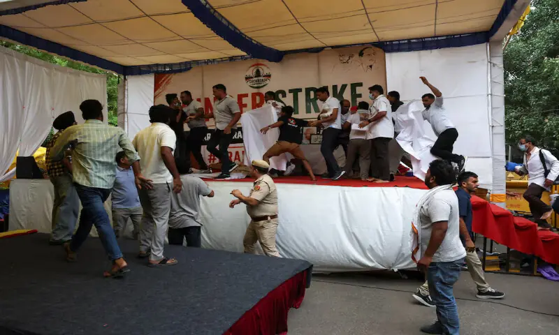 Supporters of Cockroach Janta Party step in as authorities try to take Sonam Wangchuk to the hospital during a sit-in protest at Jantar Mantar in New Delhi, India, on Saturday. -- Reuters