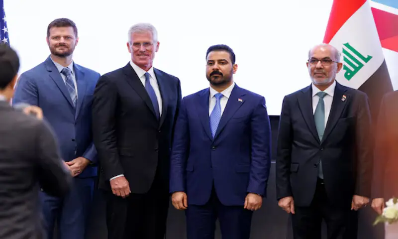 Chevron Vice Chairman Mark Nelson and Iraqi Prime Minister Ali Al Zaidi pose for a photo at Chevron's Houston headquarters, Texas, US. -- Reuters