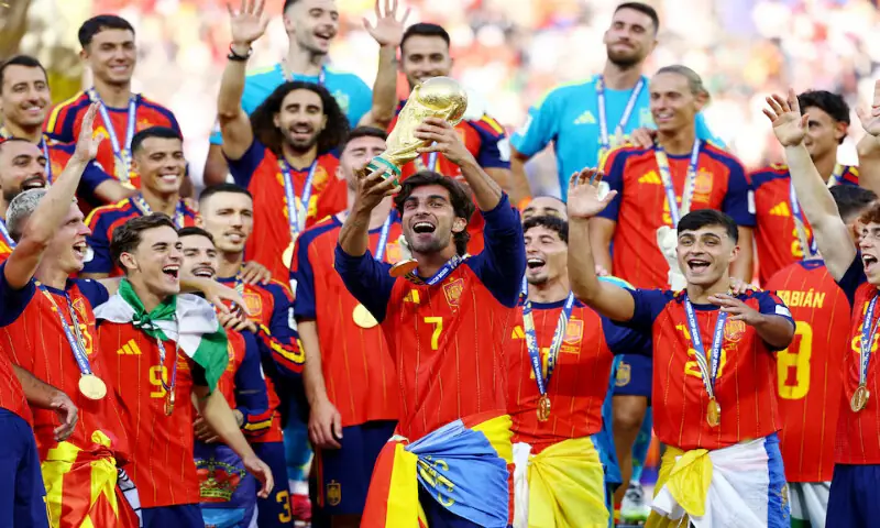 Spain's Ferran Torres lifts the trophy with teammates after winning the World Cup. -- Reuters Spain's Ferran Torres lifts the trophy with teammates after winning the World Cup. -- Reuters