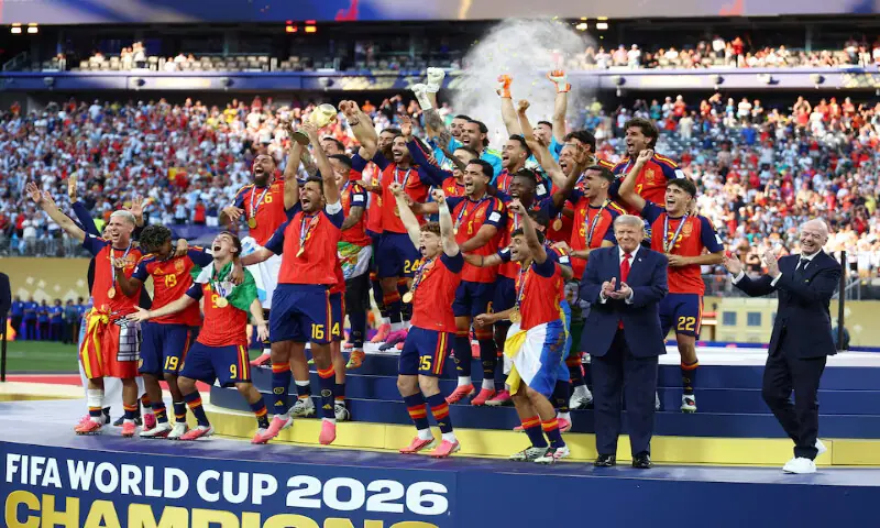 US President Donald Trump and FIFA President Gianni Infantino are seen as Spain players celebrate with the trophy after winning the World Cup. -- Reuters US President Donald Trump and FIFA President Gianni Infantino are seen as Spain players celebrate with the trophy after winning the World Cup. -- Reuters
