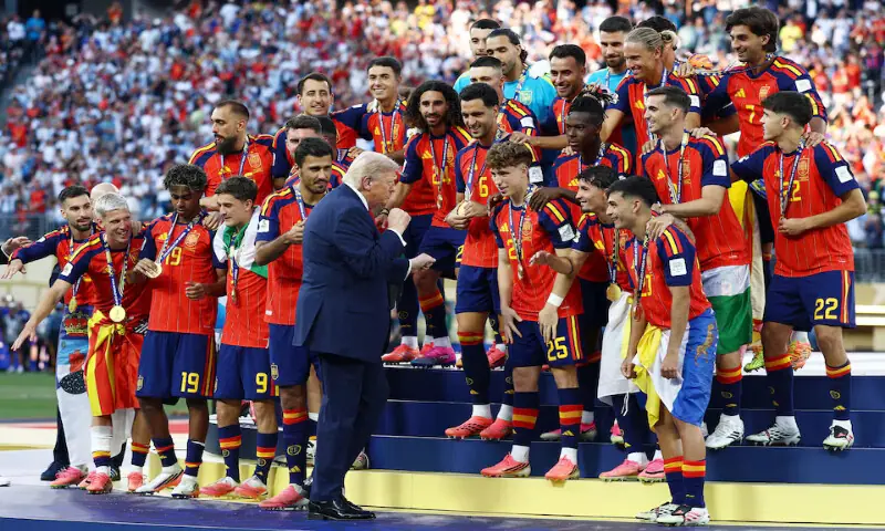 US President Donald Trump alongside Spain players during the trophy presentation. -- Reuters US President Donald Trump alongside Spain players during the trophy presentation. -- Reuters