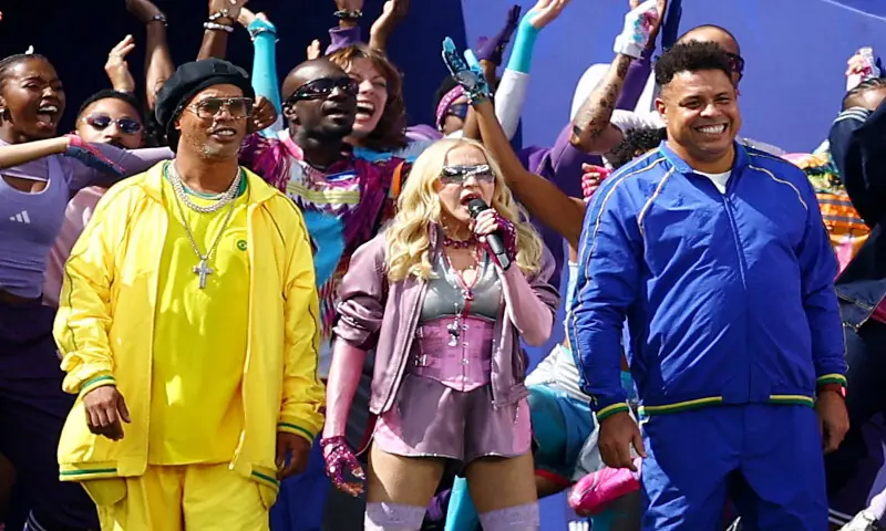 Madonna with former Brazil players Ronaldinho and Ronaldo during the halftime show. -- Reuters Madonna with former Brazil players Ronaldinho and Ronaldo during the halftime show. -- Reuters