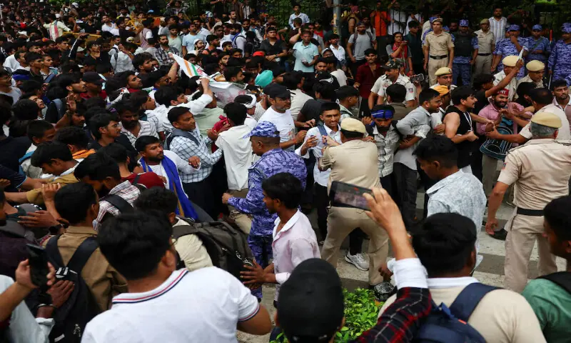 Police restrain people gathered near Jantar Mantar, ahead of a planned march to Parliament led by India's Cockroach Janta Party, demanding the resignation of Education Minister Dharmendra Pradhan over exam paper leaks, in New Delhi, India, on Monday. -- Reuters Police restrain people gathered near Jantar Mantar, ahead of a planned march to Parliament led by India's Cockroach Janta Party, demanding the resignation of Education Minister Dharmendra Pradhan over exam paper leaks, in New Delhi, India, on Monday. -- Reuters