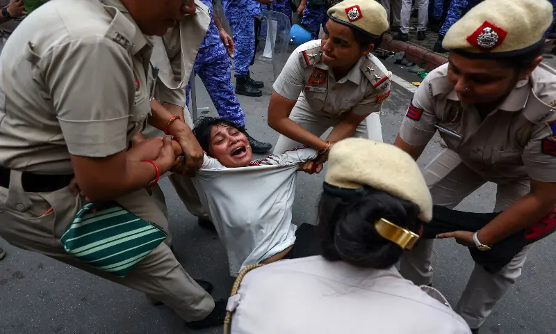 Police officers remove a protester in New Delhi. -- Reuters Police officers remove a protester in New Delhi. -- Reuters