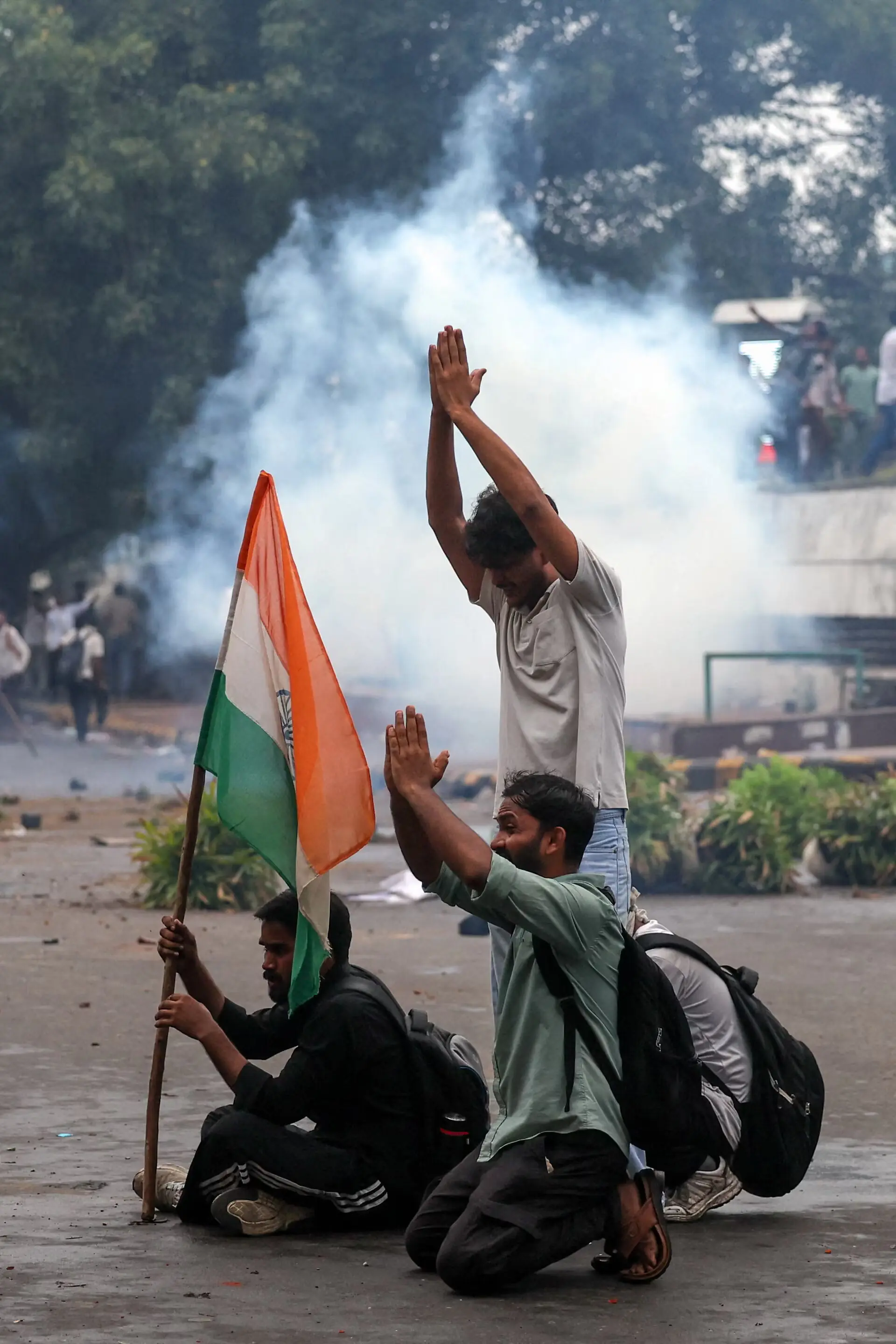 Protesters with an Indian flag gesture as they request the police not to use tear gas in New Delhi. -- Reuters Protesters with an Indian flag gesture as they request the police not to use tear gas in New Delhi. -- Reuters