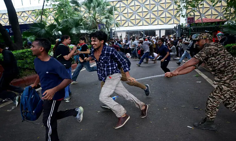 A security official wields his baton against demonstrators during the protest near Jantar Mantar, New Delhi, India. -- Reuters A security official wields his baton against demonstrators during the protest near Jantar Mantar, New Delhi, India. -- Reuters