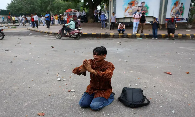 A demonstrator folds his hands requesting police to stop action during the protest in New Delhi. -- Reuters A demonstrator folds his hands requesting police to stop action during the protest in New Delhi. -- Reuters