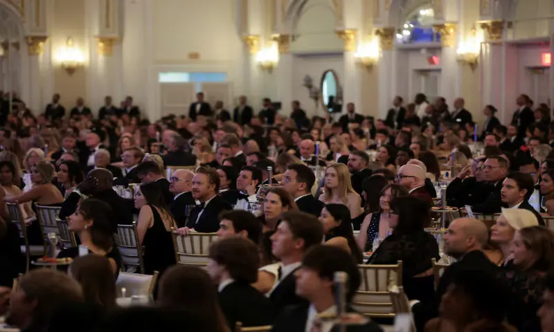 Attendees watch a video of when a man tried to force his way through security and fired a shotgun playing on the screen at the White House Correspondents' Association Dinner, at the Waldorf Astoria hotel in Washington, DC. -- Reuters Attendees watch a video of when a man tried to force his way through security and fired a shotgun playing on the screen at the White House Correspondents' Association Dinner, at the Waldorf Astoria hotel in Washington, DC. -- Reuters