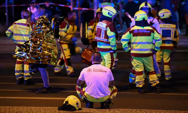 Emergency responders work at the site after a car crashed into the crowd at Tiergarten park in Berlin, Germany. -- Reuters