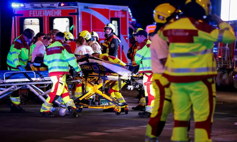 Emergency responders work on the site after a car crashed into the crowd at Tiergarten park in Berlin, Germany. -- Reuters