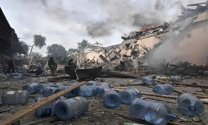 Rescuers work at a site of the drinking water delivery company hit in an air strike in Zaporizhzhia, Ukraine. -- Reuters