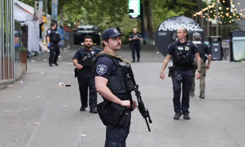 Police officers stand guard at the shooting site at Seattle Centre in Seattle. -- Reuters Police officers stand guard at the shooting site at Seattle Centre in Seattle. -- Reuters