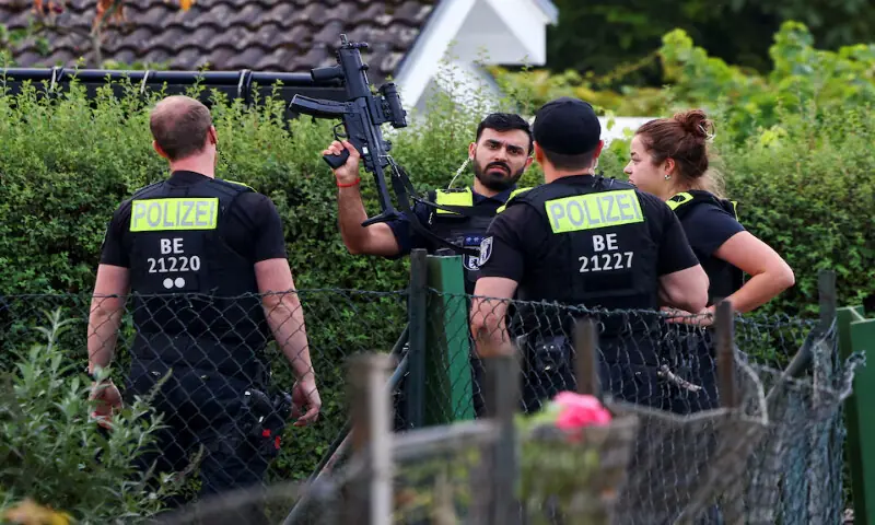 Police officers secure the area at an allotment garden complex in the Berlin suburb of Spandau after a man suspected of ramming a minivan into a crowd near Berlin's annual Christopher Street Day Pride parade, was shot and killed in a police operation, in Berlin, Germany. -- Reuters Police officers secure the area at an allotment garden complex in the Berlin suburb of Spandau after a man suspected of ramming a minivan into a crowd near Berlin's annual Christopher Street Day Pride parade, was shot and killed in a police operation, in Berlin, Germany. -- Reuters