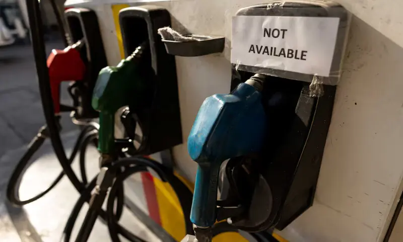 A "not available" sign is posted on a fuel dispenser at a gas station in Quezon City, Philippines. -- Reuters file
