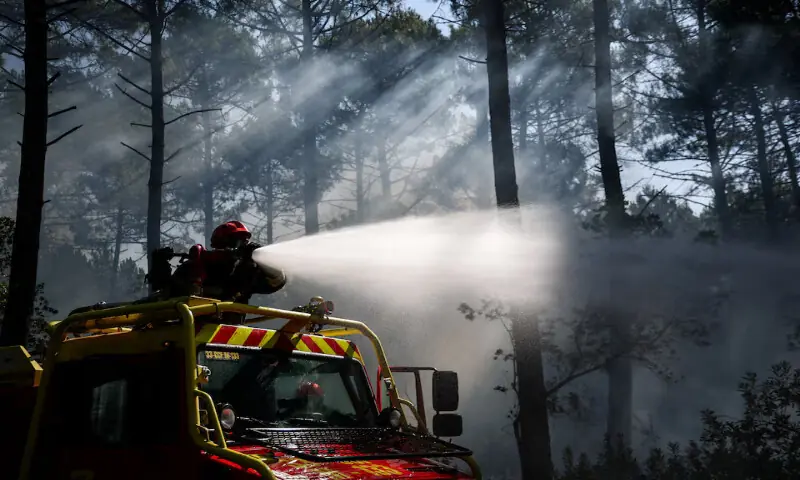 Firefighters work to put out hotspots at Le Grand Crohot amid drought conditions in France. -- Reuters