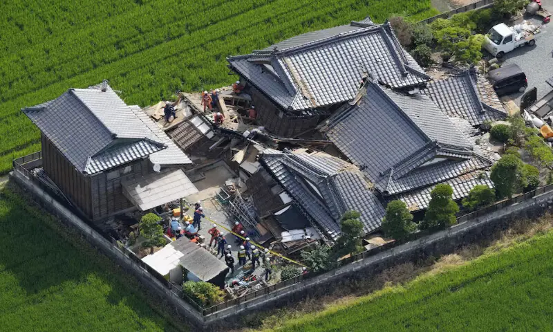 Emergency workers carry out search and rescue operations at a collapsed house after an earthquake with a magnitude of 7.1 struck Japan's southern Kumamoto prefecture, in Hikawa Town. -- Reuters