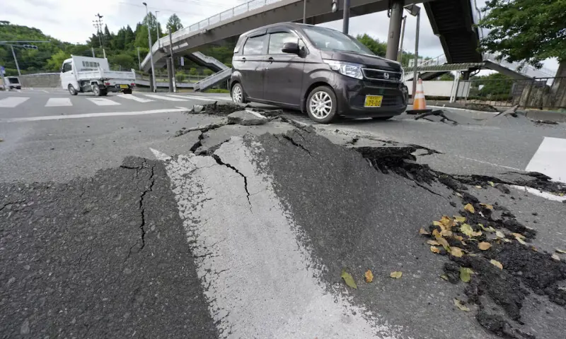 Vehicles pass a damaged road after an earthquake with a magnitude of 7.1 struck Japan's southern Kumamoto prefecture, in Hikawa town, Japan. -- Reuters