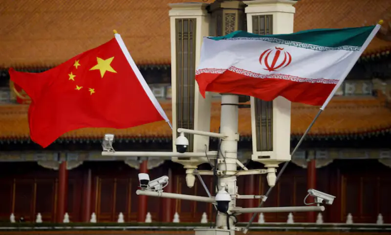 The national flags of China and Iran fly in Tiananmen Square, China. -- Reuters file
