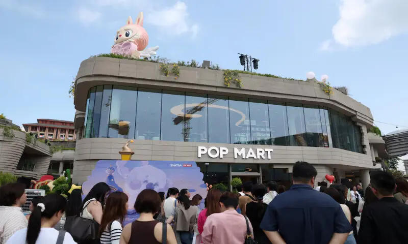 Guests wait to visit Pop Mart's first international bakery during their media day at Resorts World Sentosa in Singapore on Wednesday. -- Reuters