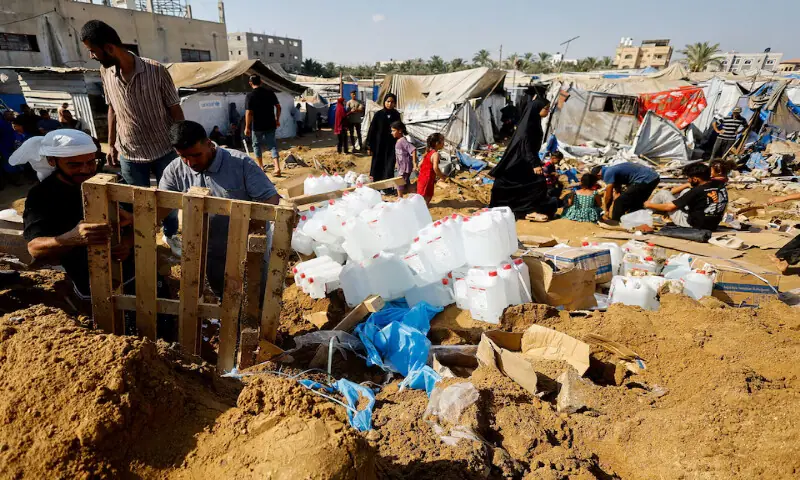 Palestinians inspect the site of an Israeli strike on a medicine warehouse next to tents sheltering displaced Palestinians in Deir Al Balah, in the central Gaza Strip. -- Reuters Palestinians inspect the site of an Israeli strike on a medicine warehouse next to tents sheltering displaced Palestinians in Deir Al Balah, in the central Gaza Strip. -- Reuters