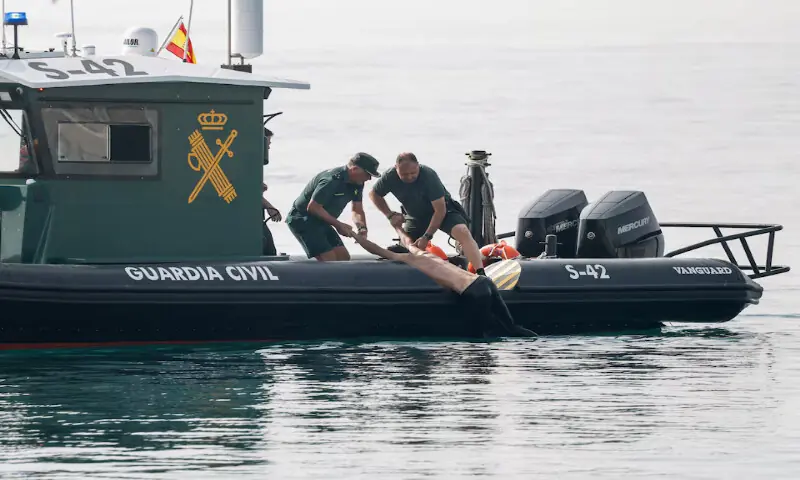 Members of the Spanish Guardia Civil rescue a migrant at sea off Ceuta, Spain. -- Reuters Members of the Spanish Guardia Civil rescue a migrant at sea off Ceuta, Spain. -- Reuters