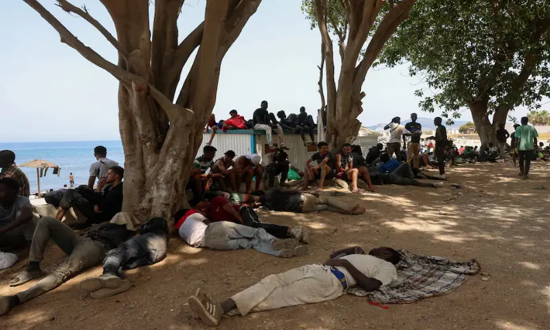 Migrants rest in Ceuta following mass crossings on foot and by sea from Morocco into Spanish territory. -- Reuters Migrants rest in Ceuta following mass crossings on foot and by sea from Morocco into Spanish territory. -- Reuters