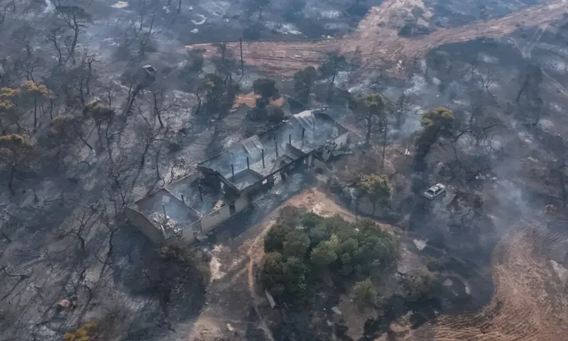 A drone view of burned out area of a settlement after a wildfire passed through, in Veniza, near Megara, Greece. -- Reuters A drone view of burned out area of a settlement after a wildfire passed through, in Veniza, near Megara, Greece. -- Reuters
